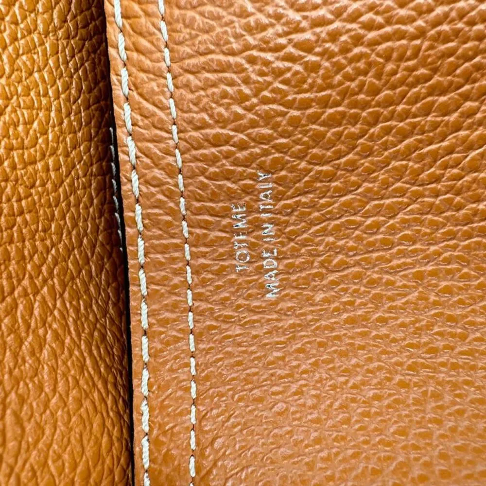 Totême T-Lock Grained-Leather Clutch in Tan Brown Leather